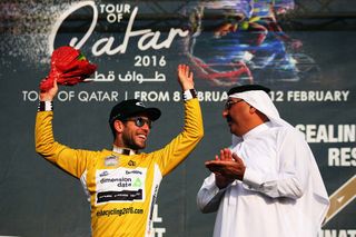 Mark Cavendish (Dimension Data) celebrates in the Tour of Qatar leader's jersey
