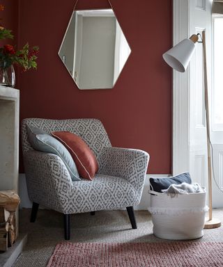 living room with burgundy colour with mirror