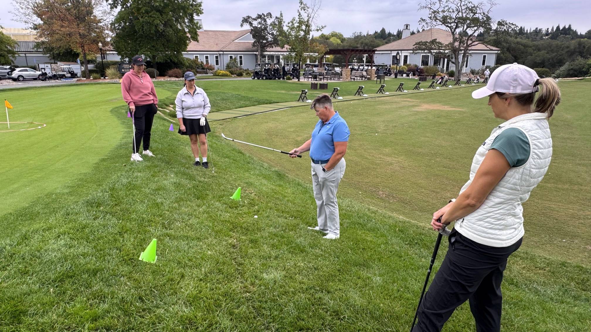 Female golfers having a group lesson
