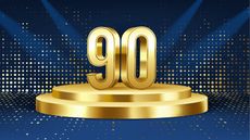 The number 90 in gold on a pedestal.