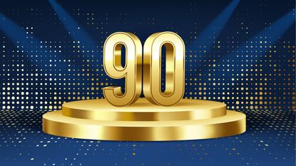 The number 90 in gold on a pedestal.