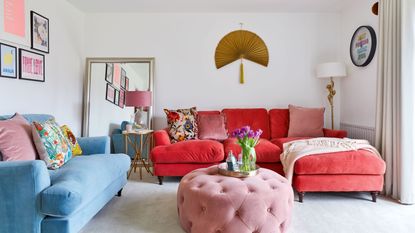 Modern-style dining table with wishbone chairs and floral pink wallpaper