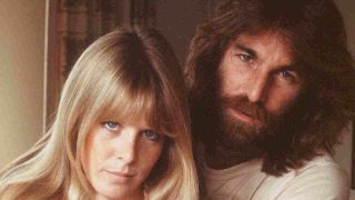 The Beach Boys’ Dennis Wilson posing for a photograph with partner Karen Lamm in 1977