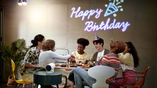The Samsung The Freestyle home projector can travel anywhere you do: image shows birthday party using The Samsung The Freestyle home projector