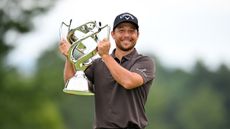 Xander Schauffele poses with the Baycurrent Classic trophy after winning in 2025
