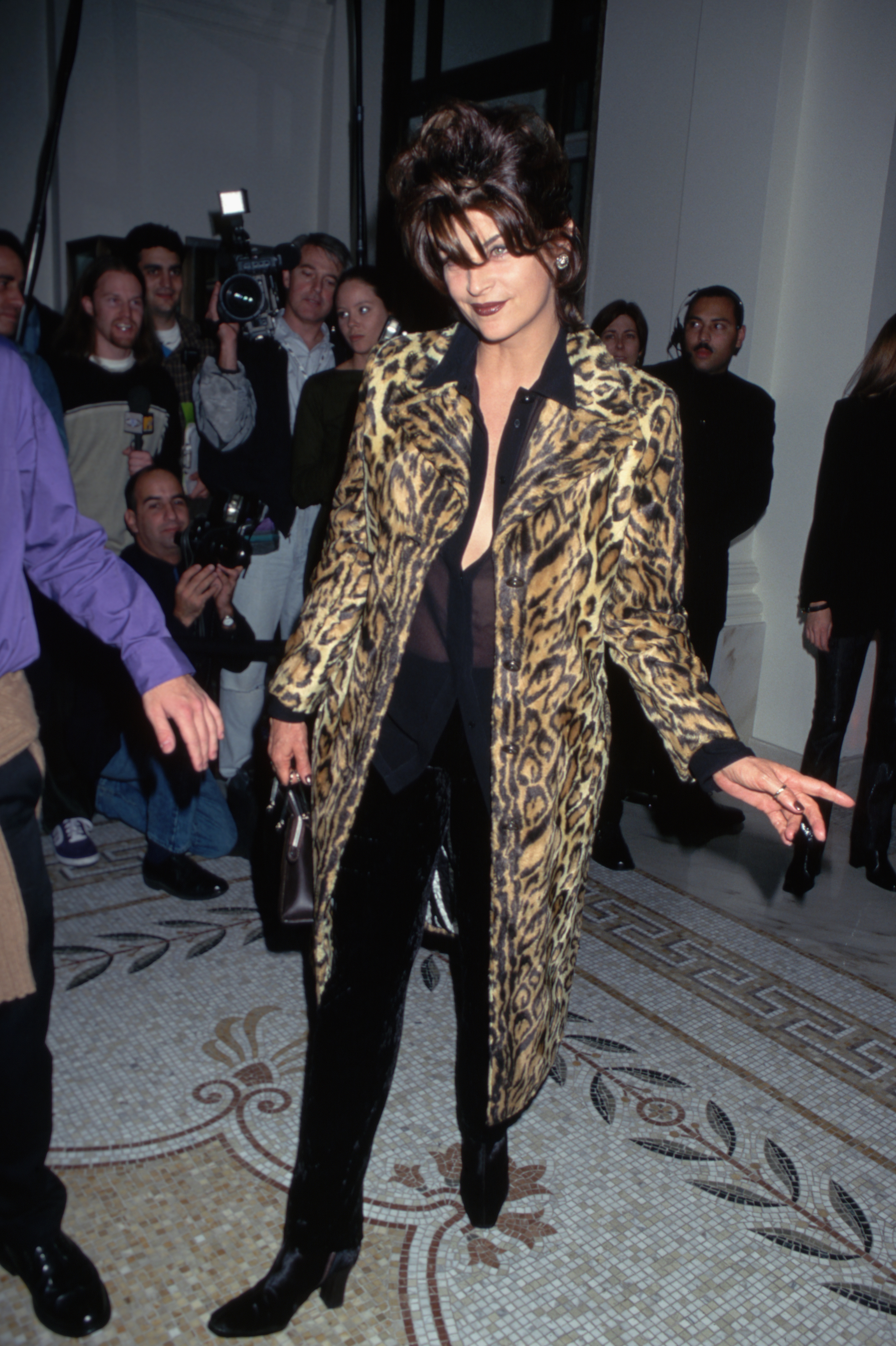 Kirstie Alley wearing Versace.