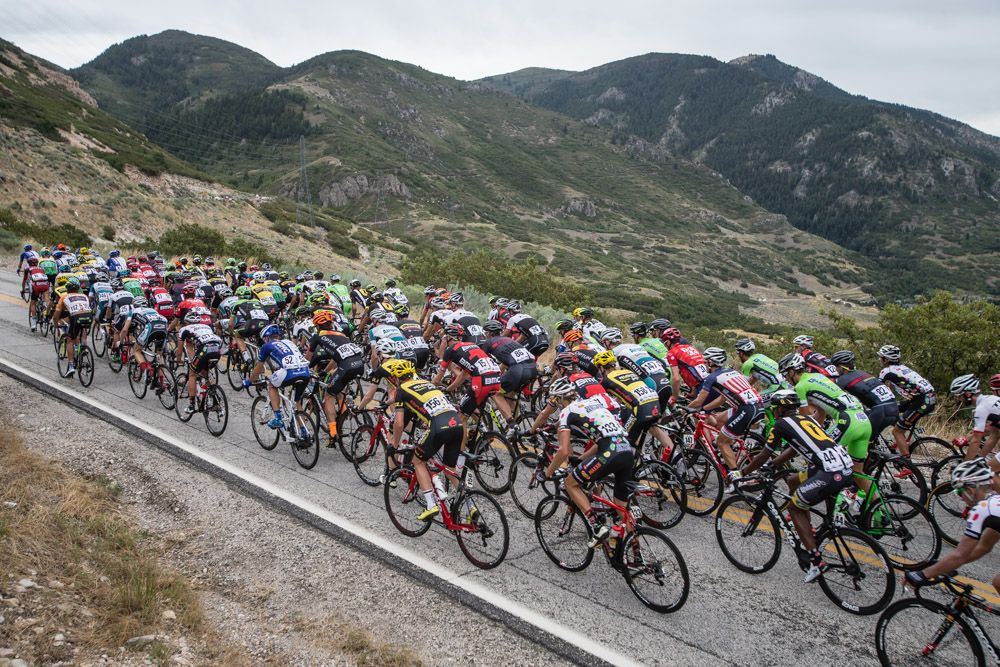 The peloton heads for eh first climb of the day.