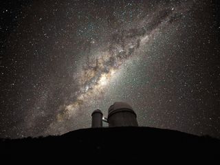 The galactic center and bulge above the ESO 3.6-metre telescope.