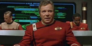 Star Trek Captain Kirk sitting in the captain's chair