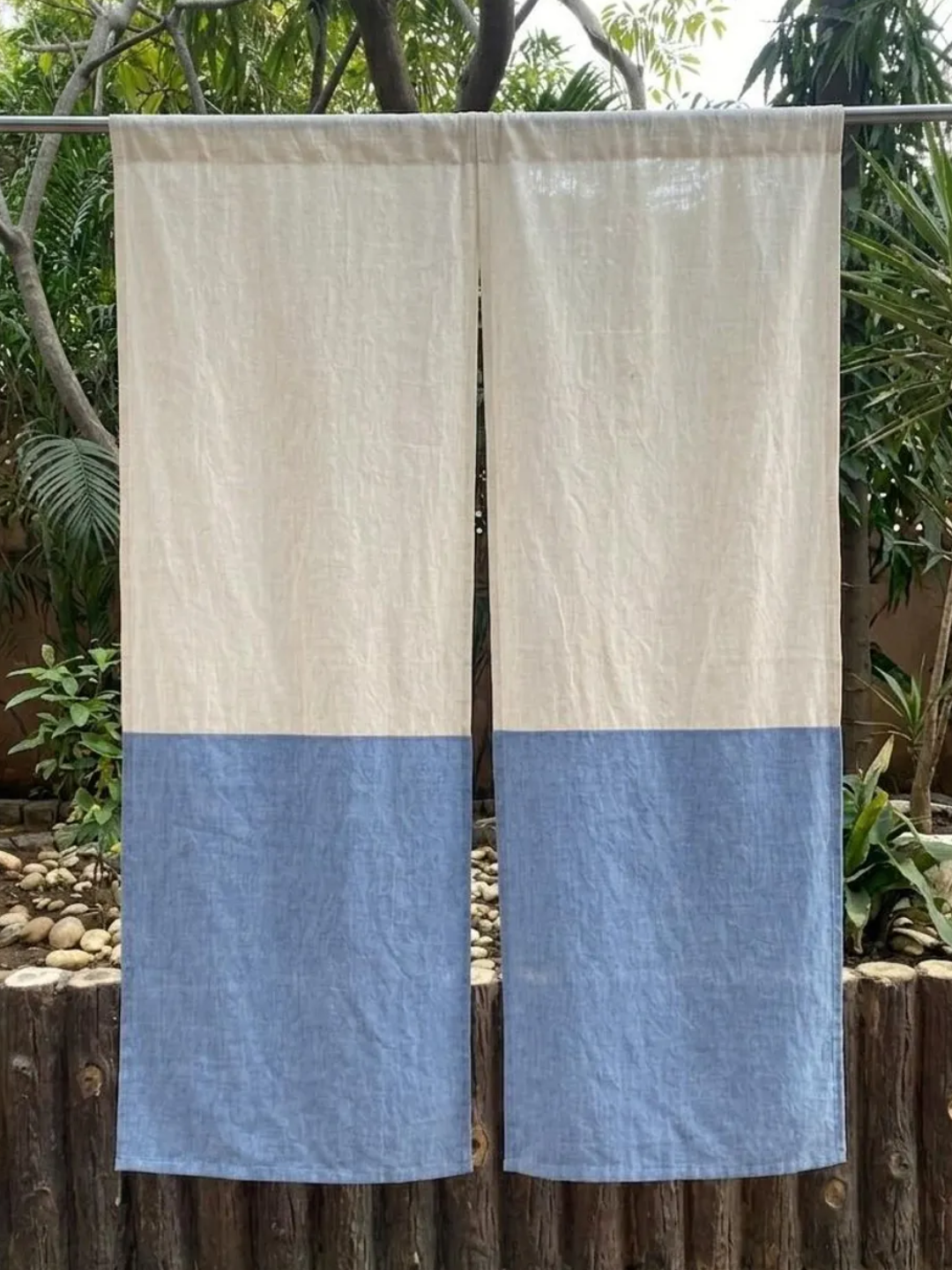 A Japanese noren set with a two-toned blue and white finish