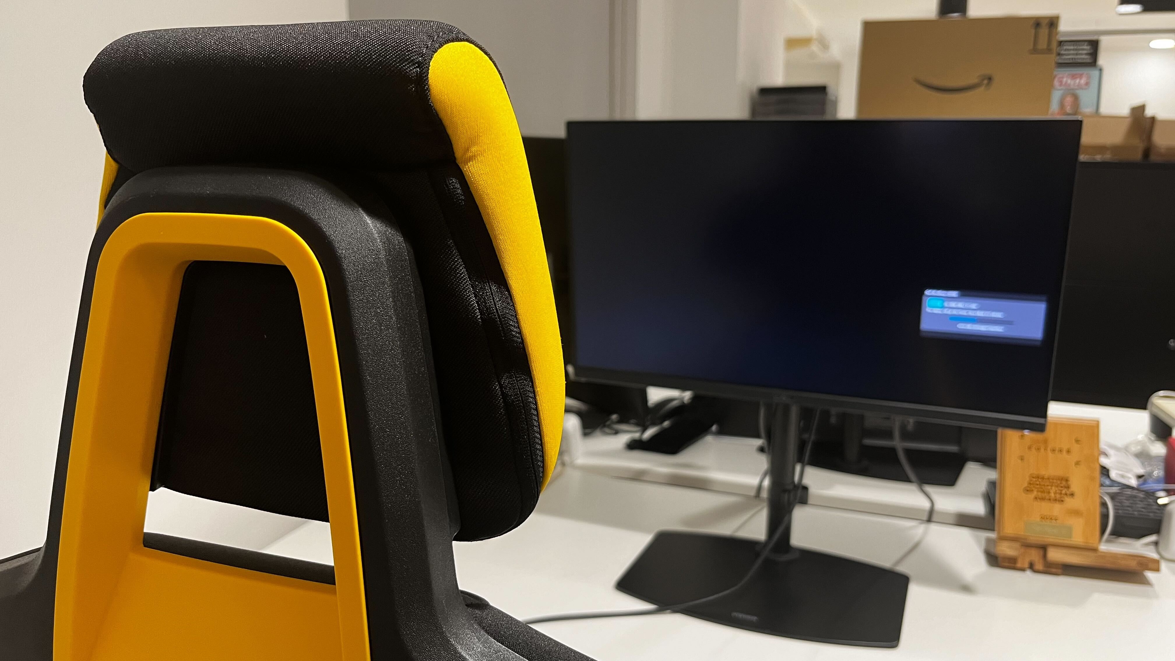 The Sybr Si1 Gaming Chair at a desk.