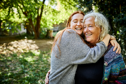 Daughter hugging mum as lockdown rules change to allow overnight stays with family