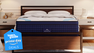 The DreamCloud Premier Hybrid mattress on a bed frame in a softly lit room with a badge over the image saying Amazon Prime Day