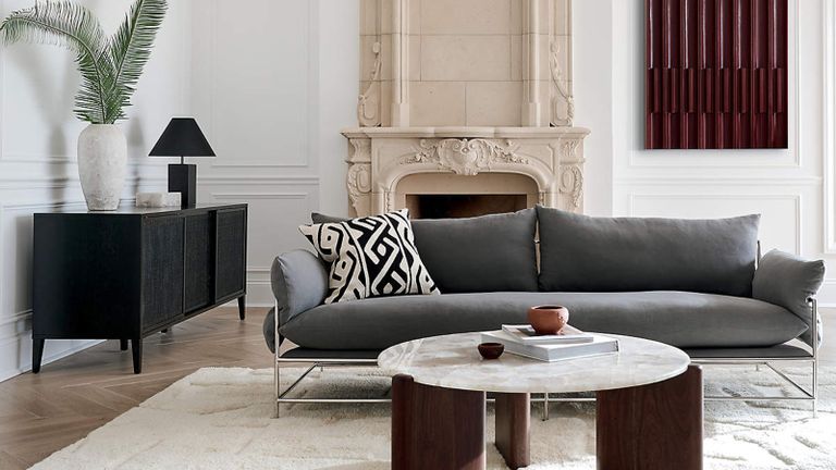 A gray sofa with a chrome frame in a modern living room