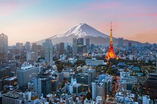 The Tokyo skyline with Mount Fuji in the background.