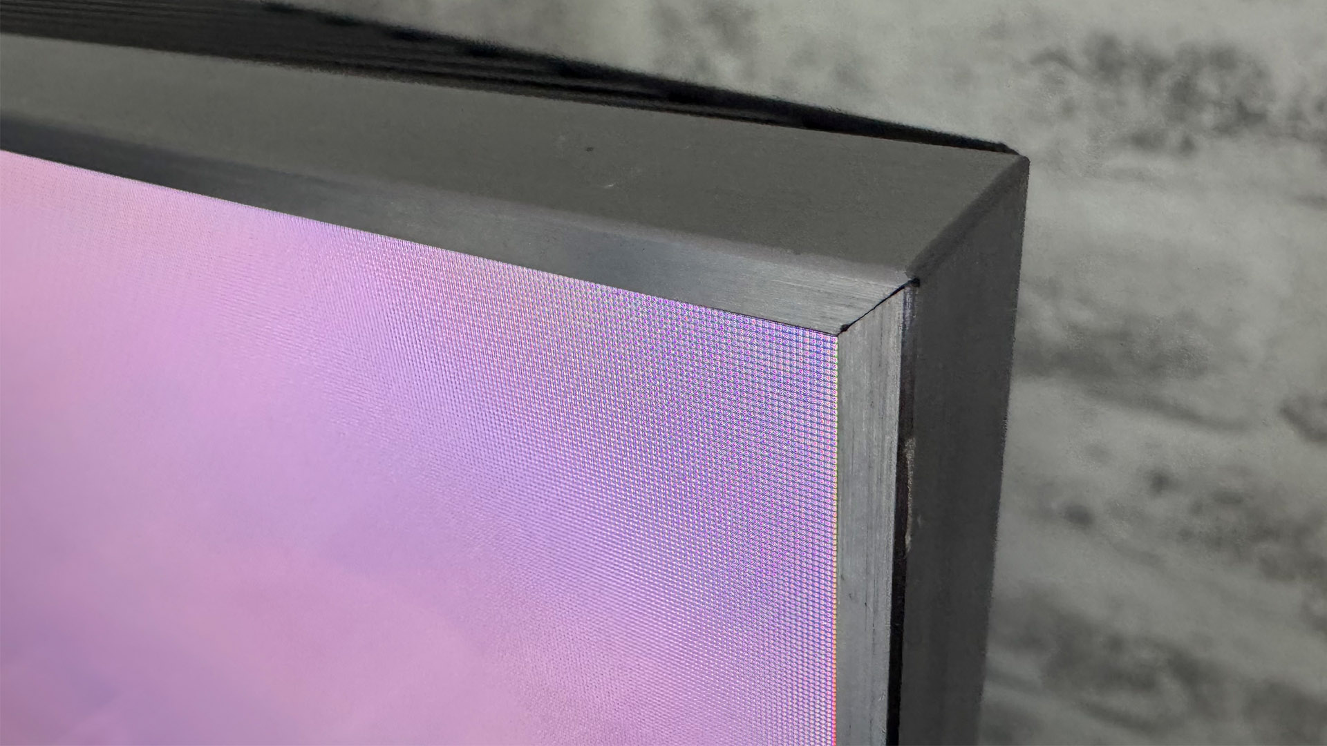 The 65-inch TCL C7K Mini LED TV photographed in a living room