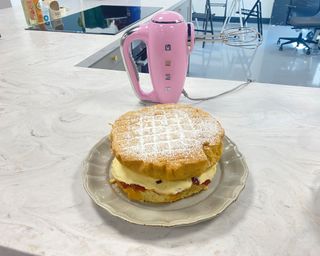 Image of Smeg hand mixer and cake in testing process