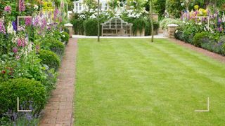 garden with flower borders surrounding a lawn to support key Monty Don lawn care tips