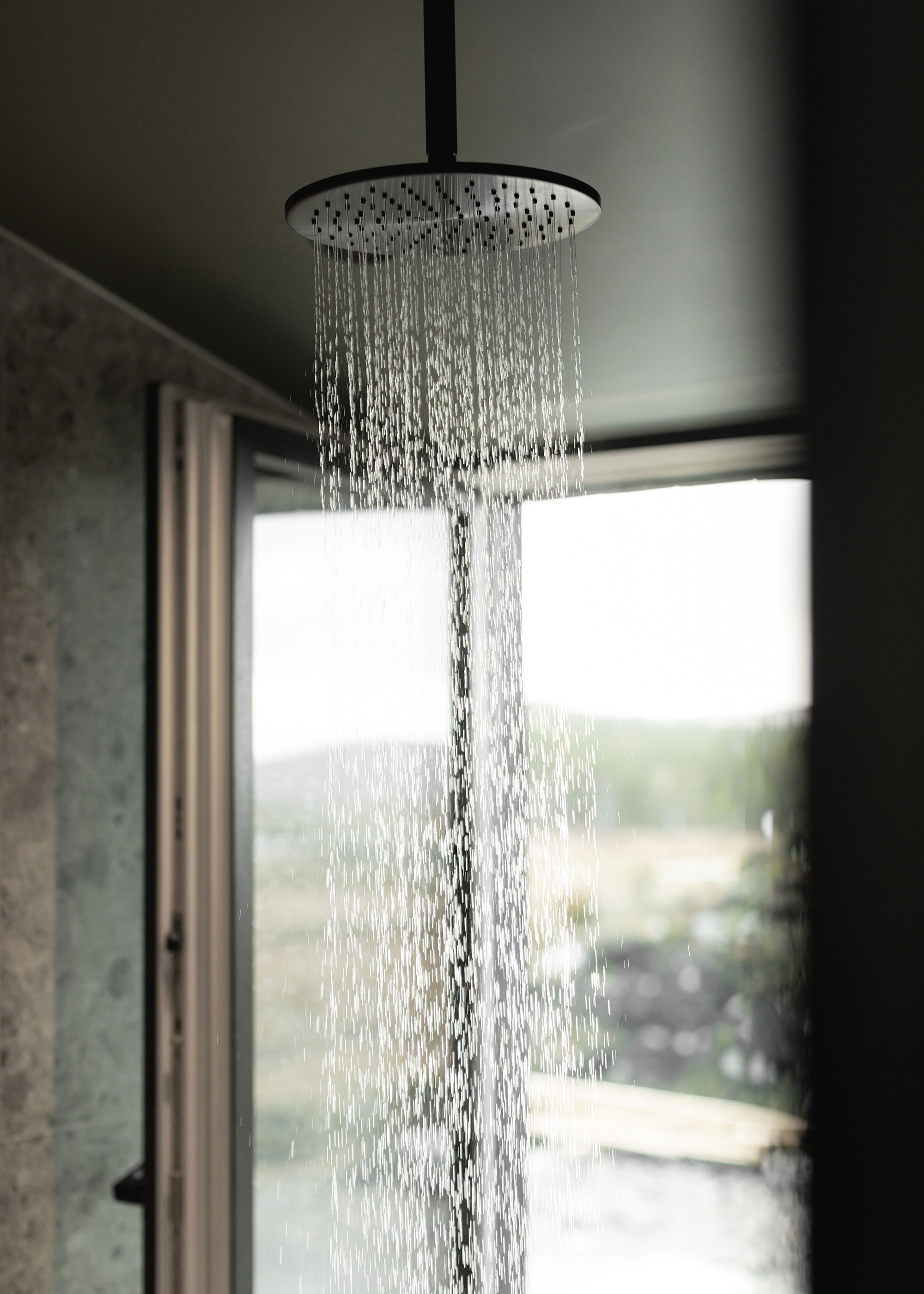 circular ceiling-mounted shower head