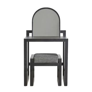 The Armand Vanity in black and a small matching stool with grey upholstered cushioning, plus vanity mirror and a modern aesthetic