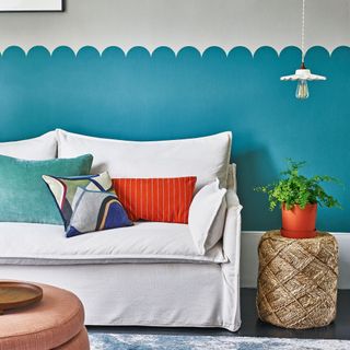 bedroom with bright blue scalloped wall