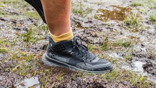 the Columbia Konos TRS OutDry Mid Shoe walking through mud