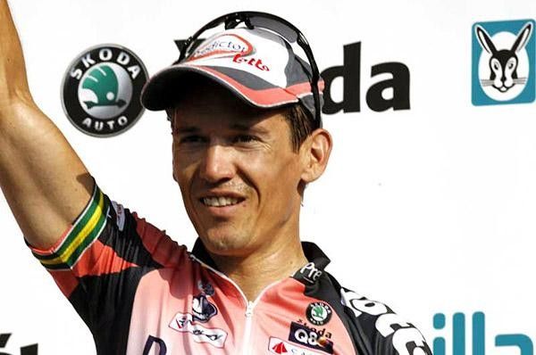 McEwen cracks a smile for the cameras on the stage winners' podium