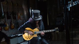 Slash with his new Gibson signature “Victoria” Les Paul Standard Goldtop