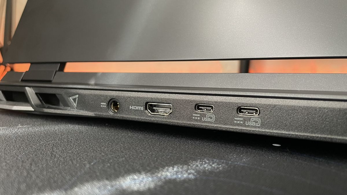 Close-up of the ports on the back edge of the Acer Nitro 17 on a black desk.
