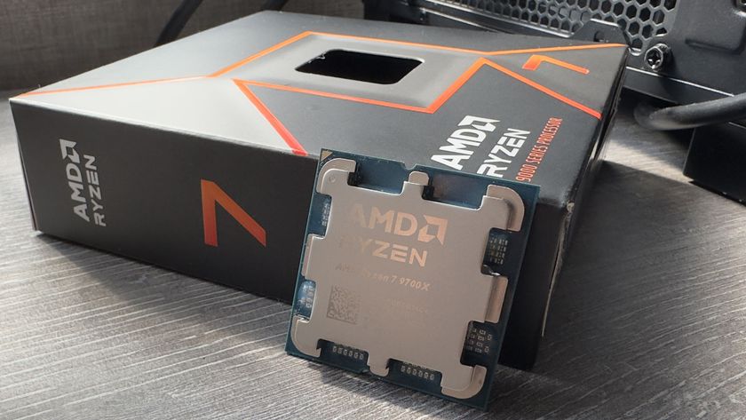 A photo of an AMD Ryzen 7 9700X processor next to its retail packaging box