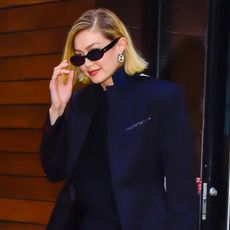Gigi Hadid leaves her apartment wearing leggings and a blazer