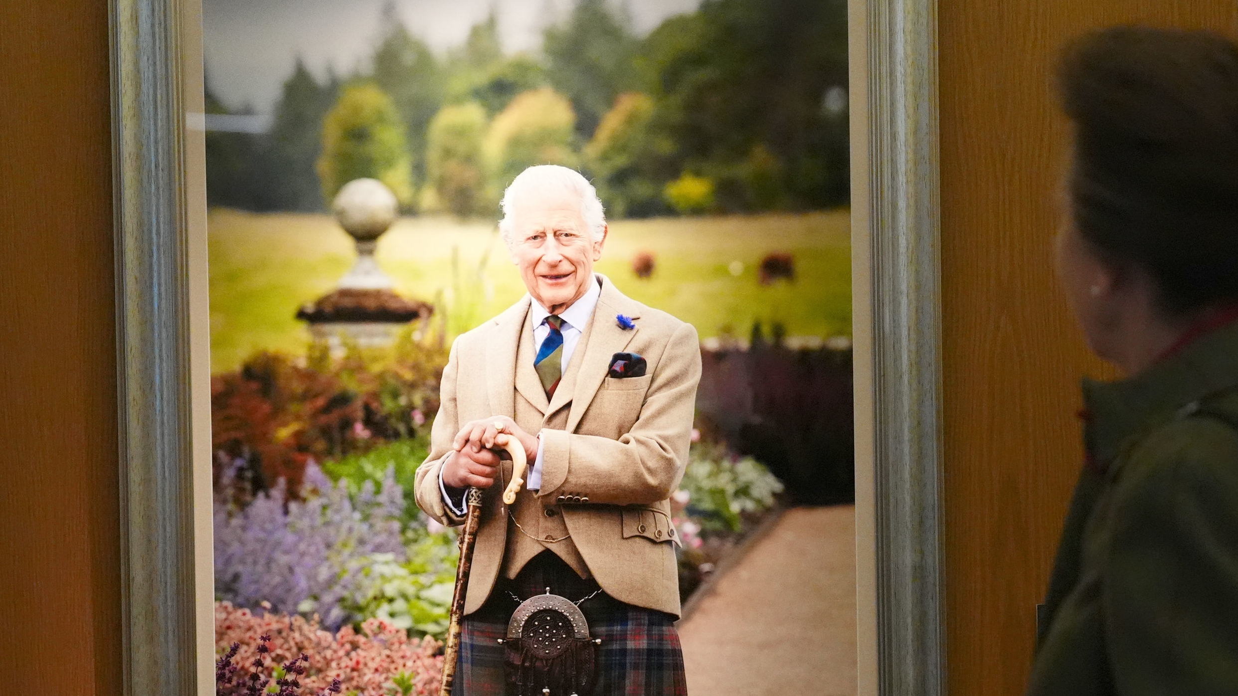 Princess Anne, Princess Royal unveils a new portrait of King Charles III, taken by photographer Millie Pilkington, during a visit to the Scottish Parliament Building, Holyrood