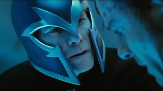 Kevin Bacon looks down at Michael Fassbender while wearing his mind protection helmet in X-Men: First Class.