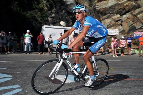 Peter Velits (Team Milram) on his way to the Most Aggressive Rider award on the stage.