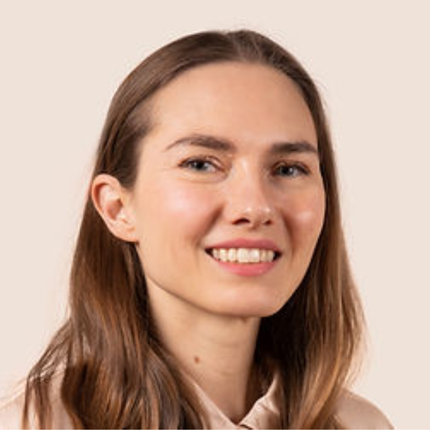 A smiling woman with brown hair