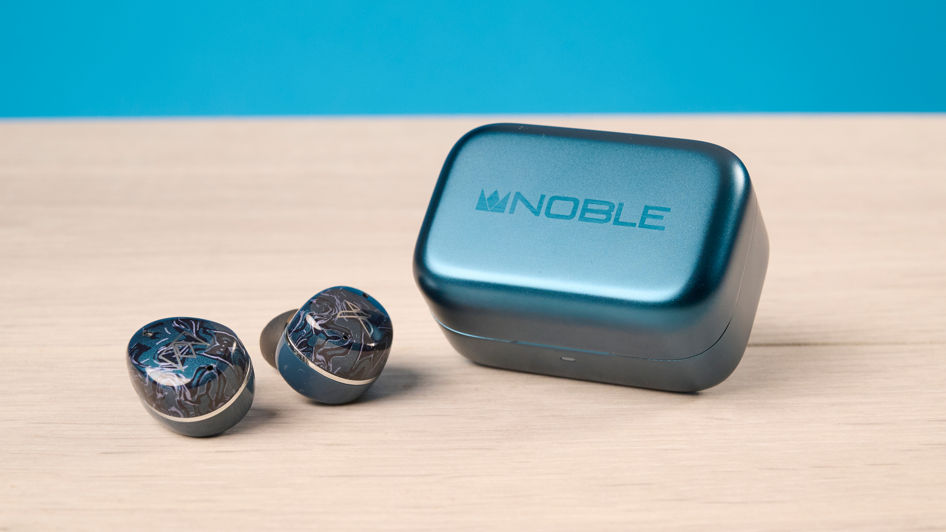 A pair of Noble Audio Osprey wireless earbuds