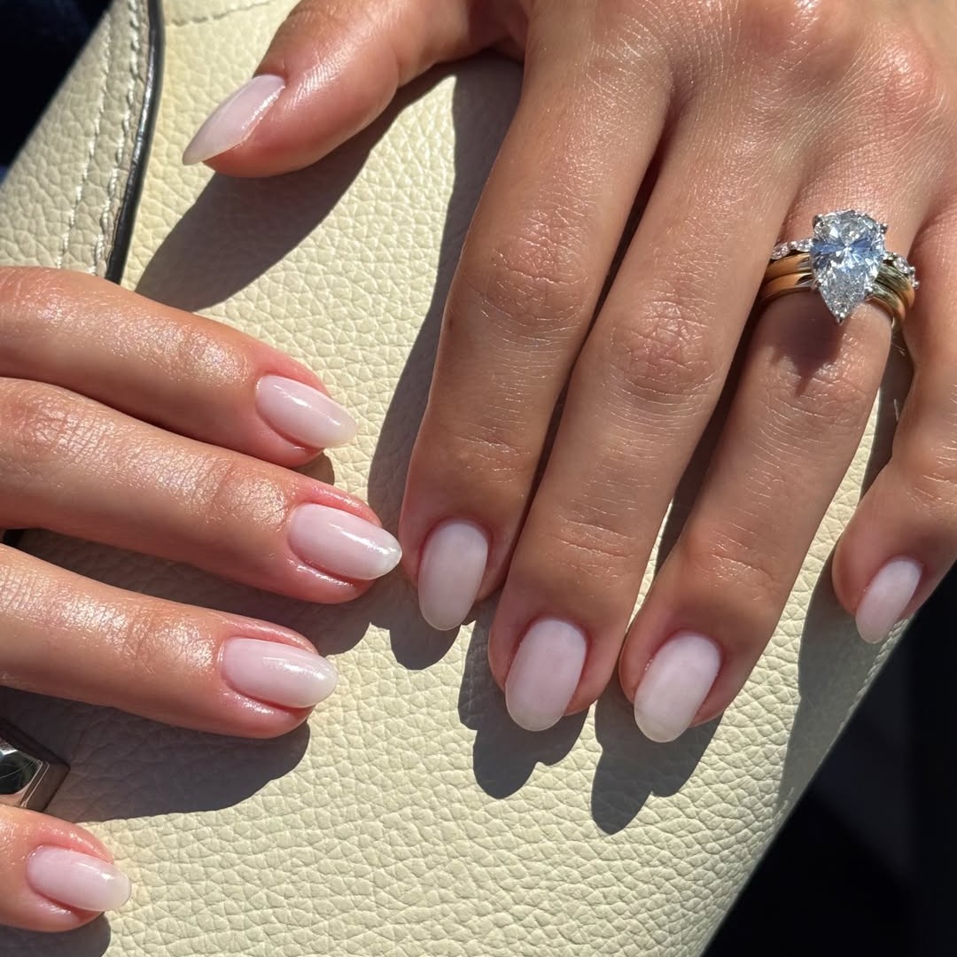 A milky white engagement manicure.