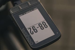 This image shows an upside down Wahoo head unit displaying tyre pressure of 88-92PSI