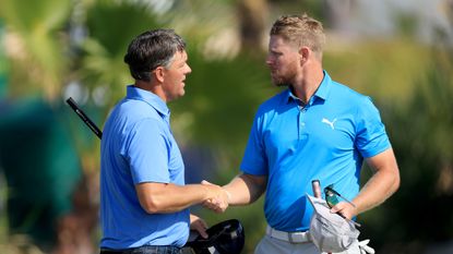Ken Weyand of The United States (L) shakes hands with his playing partner Jens Dantorp of Sweden on the 18th hole during the final round of the Dubai Invitational at Dubai Creek Golf and Yacht Club on January 14, 2024