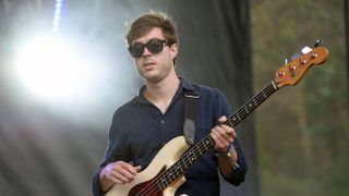 Joe Dart on stage with Vulfpeck playing bass