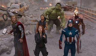 The Avengers standing in formation, looking up at the threat in the sky