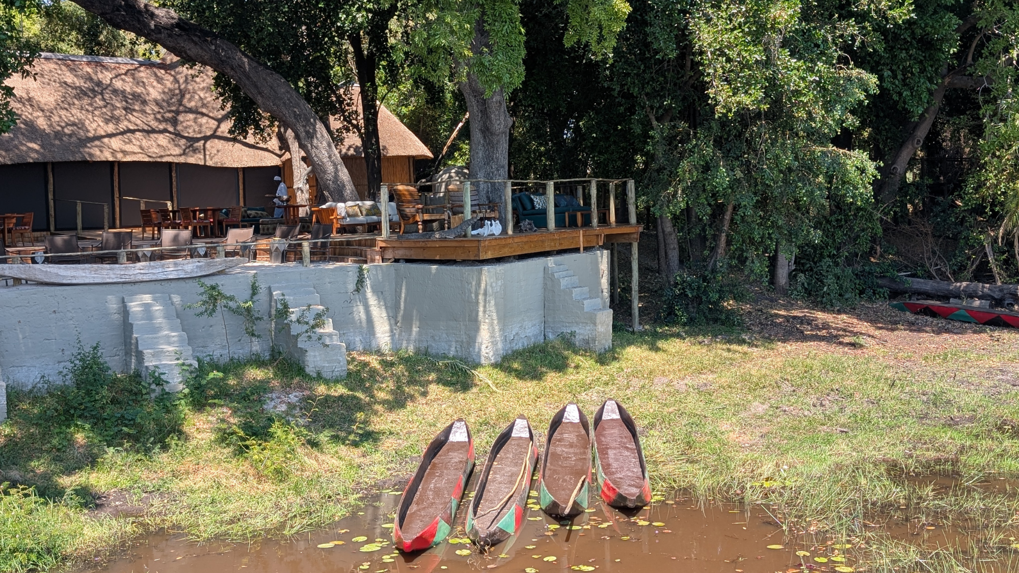 Boats on the river outside Nxamaseri Island Lodge