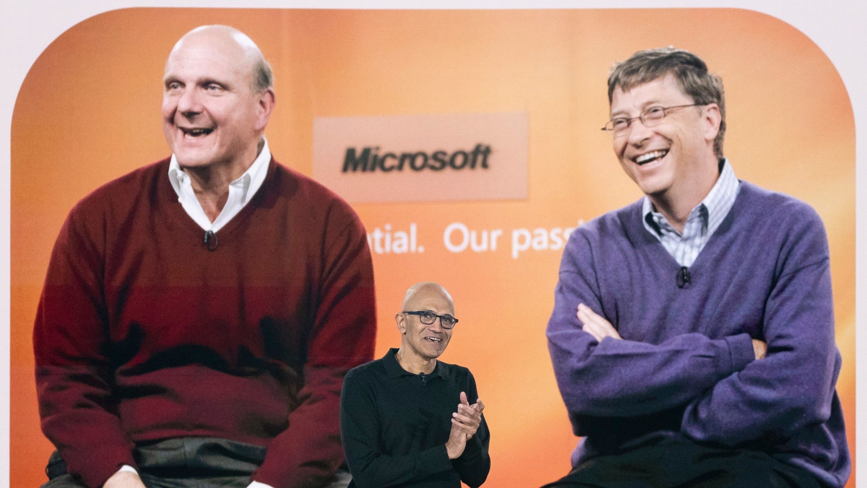 Satya Nadella, chief executive officer of Microsoft Corp., speaks in front of a photo of Bill Gates, co-founder and former chief executive officer of Microsoft Corp., and Steve Ballmer, former chief executive officer of Microsoft Corp., during an event commemorating the 50th anniversary of the company at Microsoft headquarters in Redmond, Washington, US, on Friday, April 4, 2025.