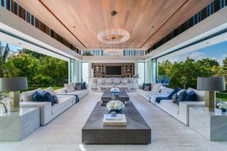 A living room with a wooden ceiling
