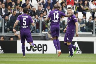 Fiorentina’s Nikola Milenkovic, right, celebrates
