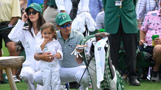 Rickie Fowler with his wife, Allison Stokke and daughter, Maya, during the Par-3 Contest prior to Masters Tournament