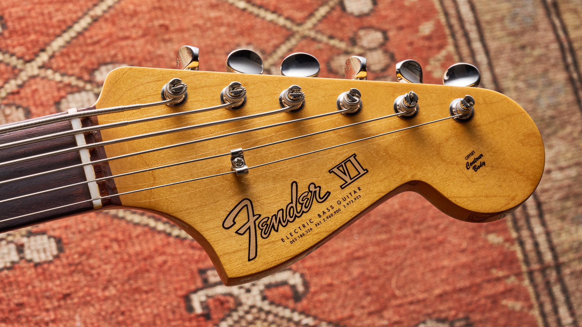 Fender vintera III Early '60s Bass VI in Olympic White with red tortoiseshell pickguard.