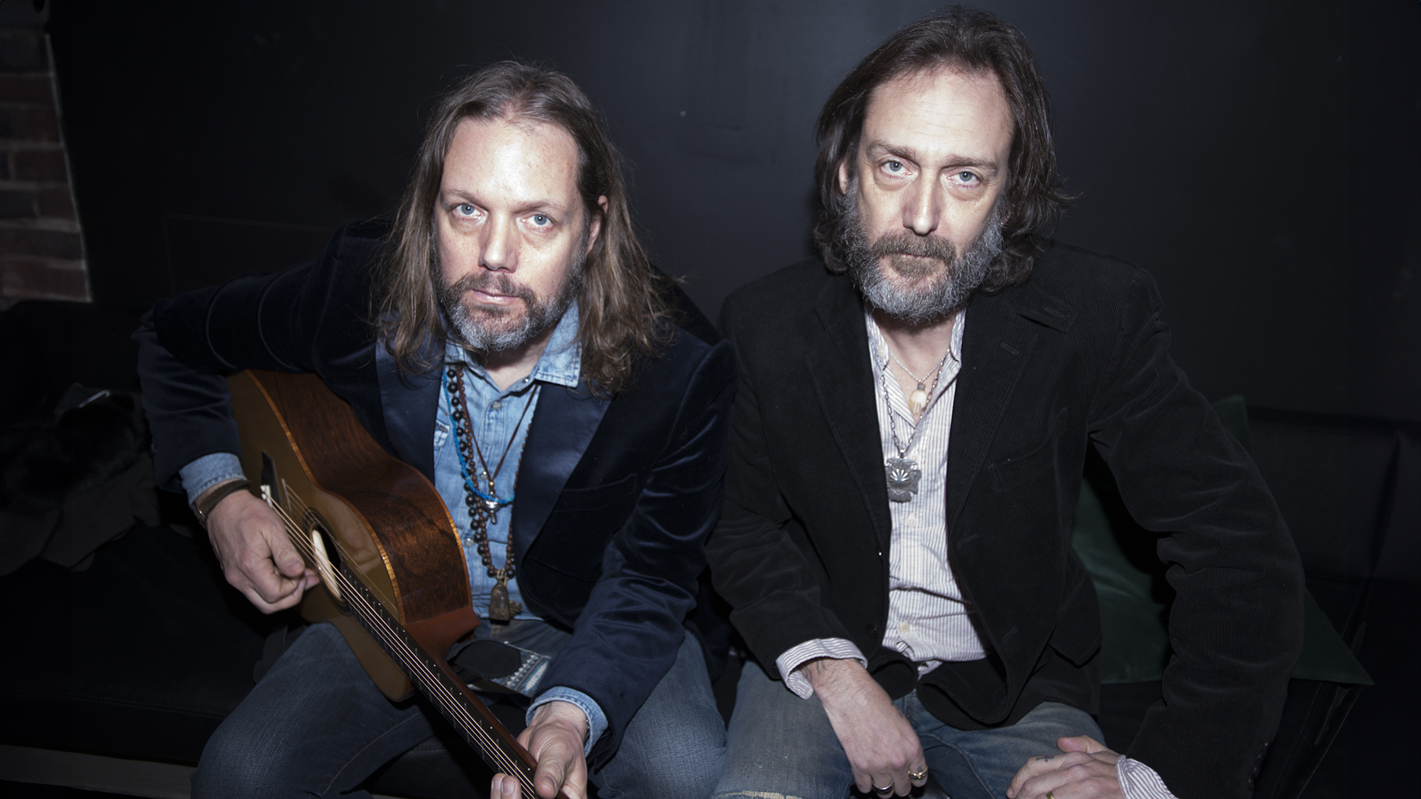 Portrait of American sibling musicians Rich and Chris Robinson, of the group the Black Crowes, as they pose backstage at Lincoln Hall, Chicago, Illinois, February 27, 2020. 
