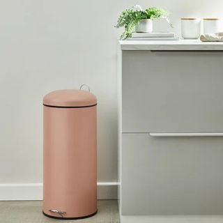 Pink metal kitchen bin by Dunelm in kitchen