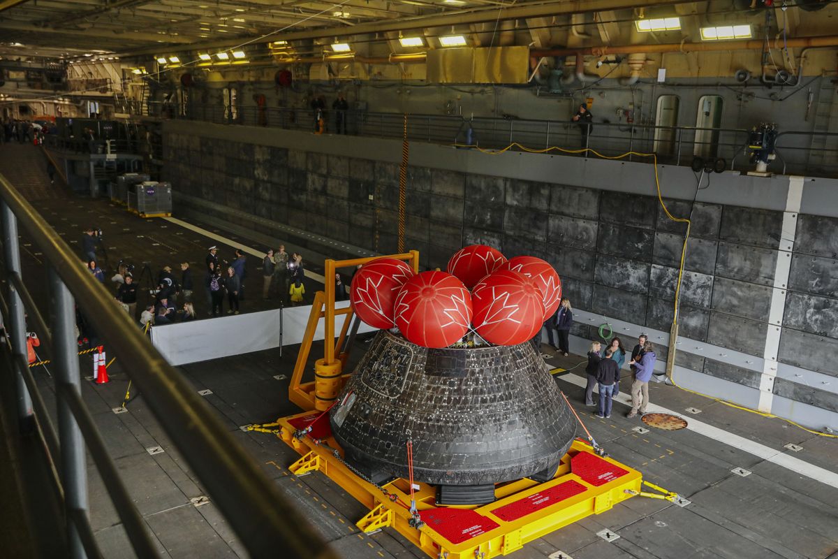 Pictures of the Orion spacecraft being treated after arriving in port in San Diego on Dec. 13, 2022.